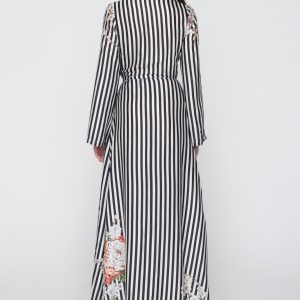 Woman in black & white maxi dress