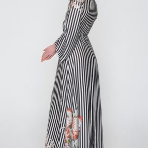 Woman in black & white maxi dress