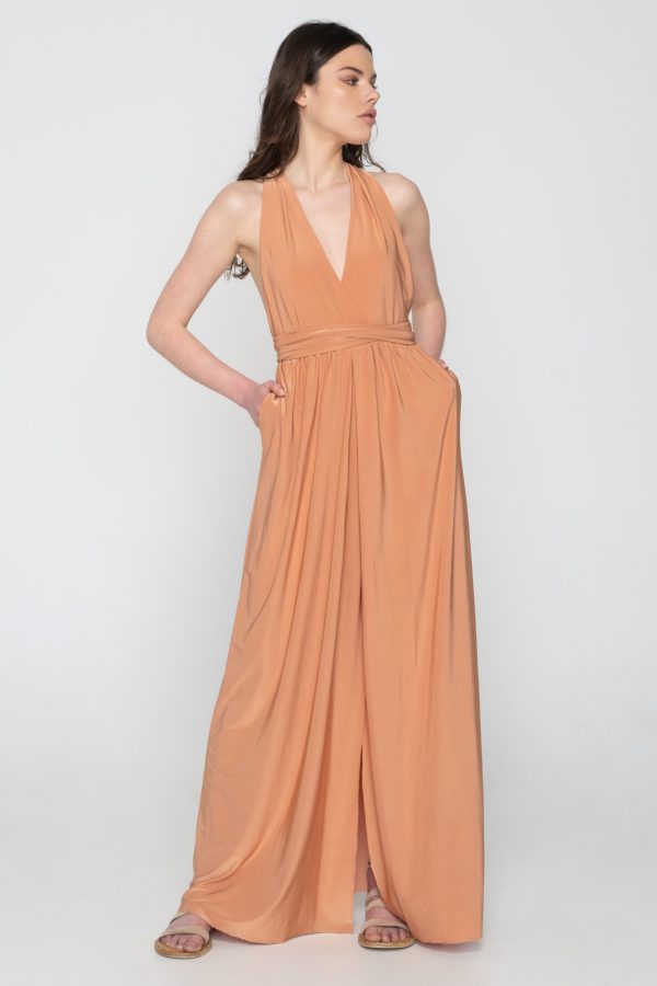 Woman in nude maxi dress