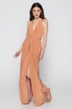 Woman in nude maxi dress