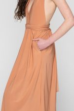 Woman in nude maxi dress