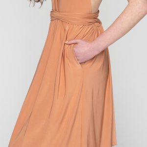 Woman in nude maxi dress