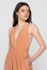 Woman in nude maxi dress