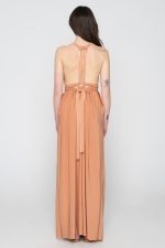 Woman in nude maxi dress