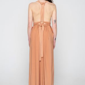 Woman in nude maxi dress