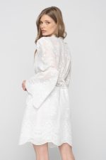 Woman in white mini dress