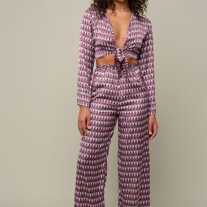 Woman in patterned set of pants and top