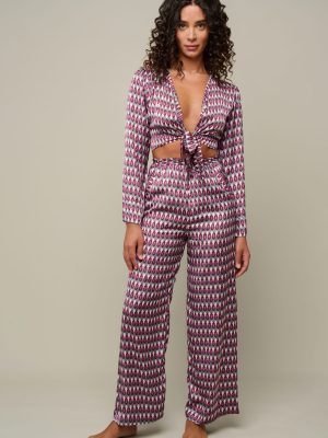 Woman in patterned set of pants and top