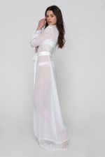 Woman wearing white beachwear dress