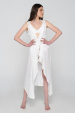 Woman wearing white beachwear dress