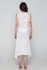 Woman wearing white beachwear dress