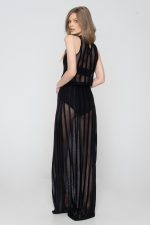 Woman wearing black beachwear dress