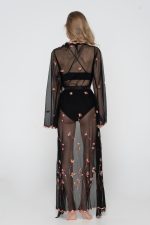 Woman wearing black beachwear kimono