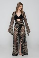 Woman wearing black beachwear kimono