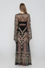 Woman wearing black beachwear kimono