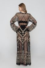 Woman wearing black beachwear kimono