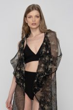 Woman wearing floral beachwear kimono