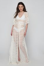 Woman wearing a white beachwear dress