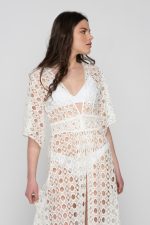 Woman wearing a white beachwear dress