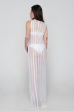 Woman wearing white beachwear dress