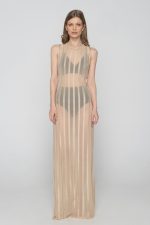 Woman wearing nude beachwear dress